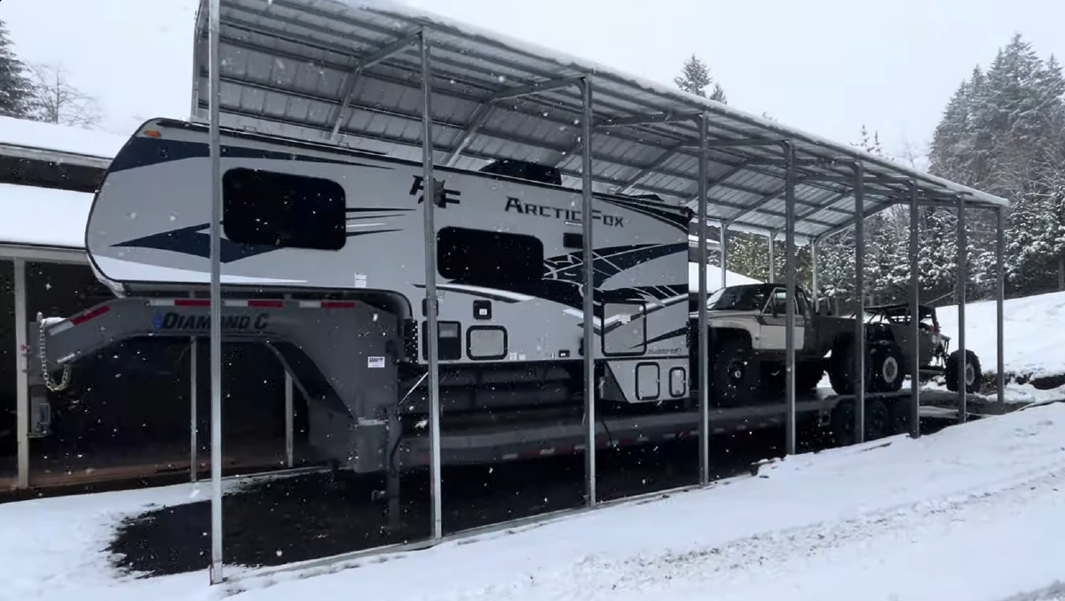slide-in camper on a gooseneck trailer for a crawler hauler